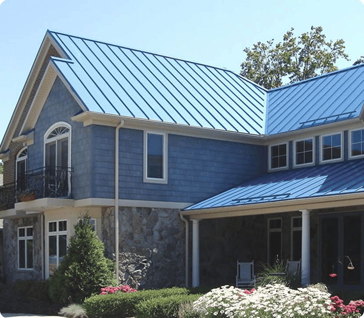 Luxury home with a bright blue standing-seam metal roof | Blue Rock Roofing & Construction | Best metal roofing in Fort Mill, SC